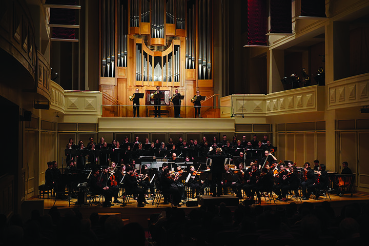An orchestra performAn orchestra performing on stageing on stage.
